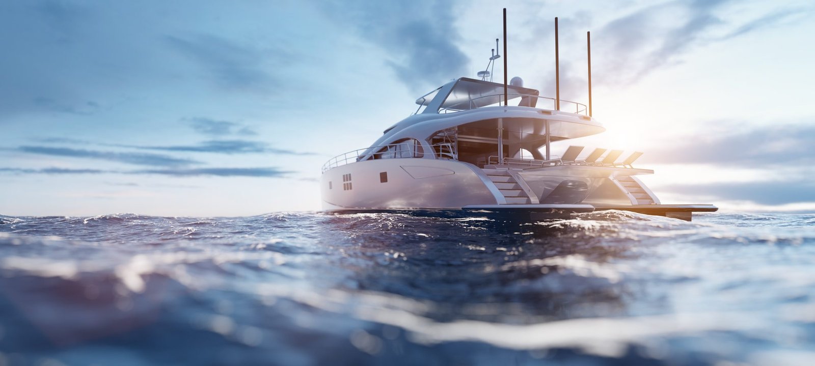 Catamaran under way at sunrise on open water