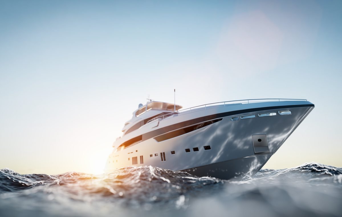 Motor yacht bow under way, high-gloss hull finish